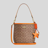 COACH City Bucket Bag In Signature Canvas With Star Charm Tan/Bright Mandarin CBH74