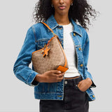 COACH City Bucket Bag In Signature Canvas With Star Charm Tan/Bright Mandarin CBH74