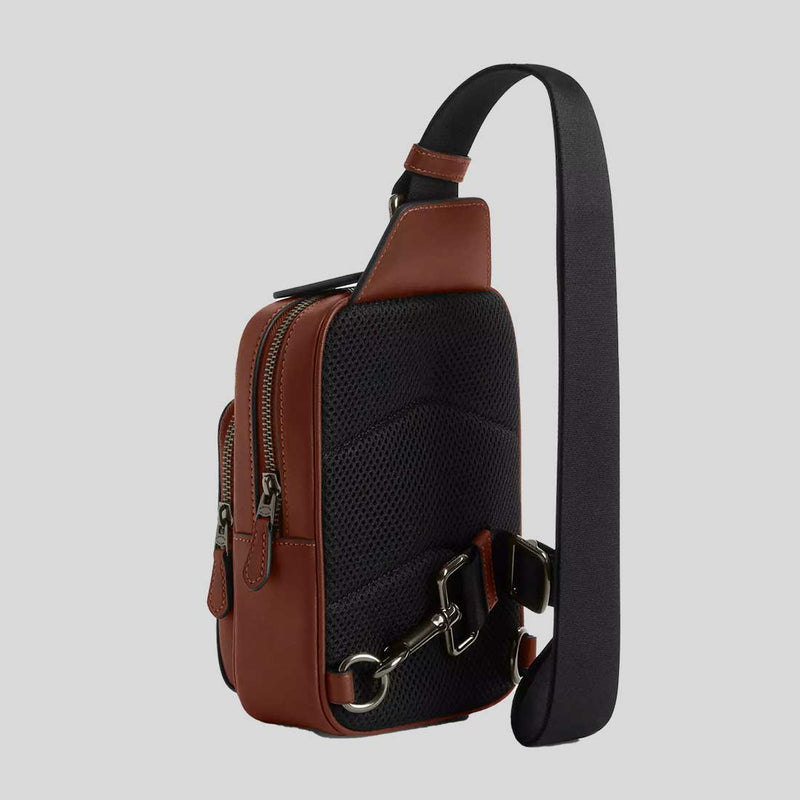 COACH Coach X Peanuts Racer Sling Pack In Signature Canvas With Snoopy Print Tan Multi CBK47