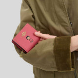 COACH Coach X Peanuts Snap Wallet With Lucy Bright Coral Multi CBN89