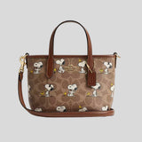 COACH Coach X Peanuts City Mini Tote Bag In Signature Canvas With Snoopy Print Tan/Brown Multi CBS83
