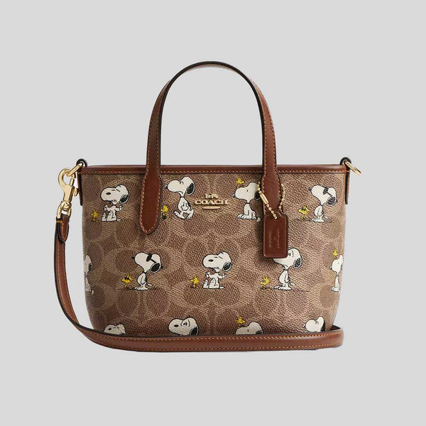 COACH Coach X Peanuts City Mini Tote Bag In Signature Canvas With Snoopy Print Tan/Brown Multi CBS83