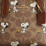 COACH Coach X Peanuts City Mini Tote Bag In Signature Canvas With Snoopy Print Tan/Brown Multi CBS83