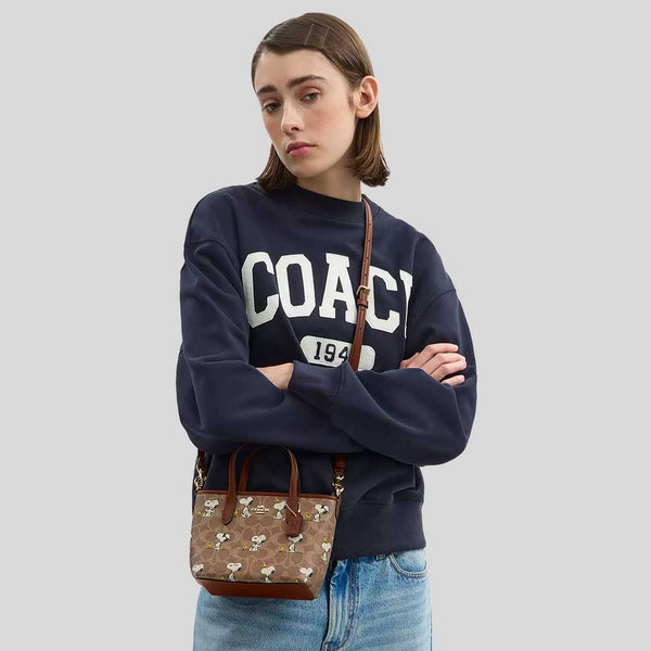 COACH Coach X Peanuts City Mini Tote Bag In Signature Canvas With Snoopy Print Tan/Brown Multi CBS83
