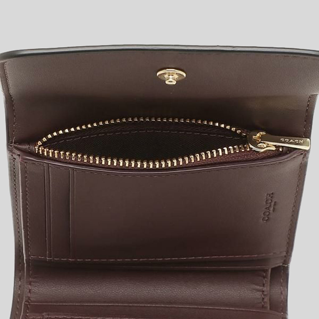 Trifold wallet in signature canvas coach best sale