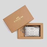 COACH Boxed Corner Zip Wristlet In Signature Canvas With Charms Gray/Silver CCK93