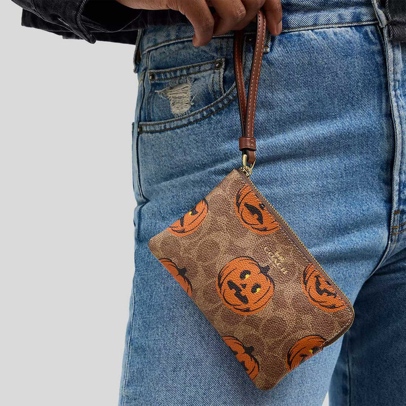 COACH Corner Zip Wristlet In Signature Canvas With Halloween Print Tan Multi CCL20