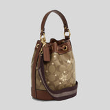 COACH Dempsey Drawstring Bucket Bag 15 In Signature Canvas With Star And Snowflake Print CN679