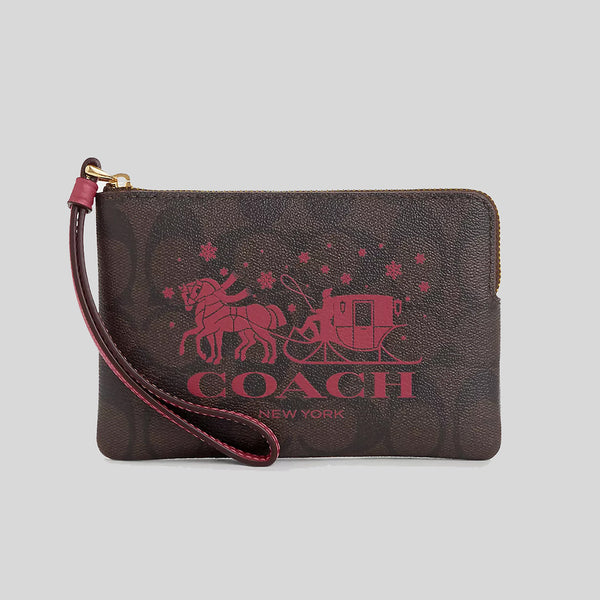 Coach Corner Zip Wristlet In Signature Canvas With Horse And Sleigh Brown/Rouge CN755