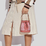 Coach Mini Dempsey Bucket Bag In Signature Jacquard With Stripe And Coach Patch Taffy C8322