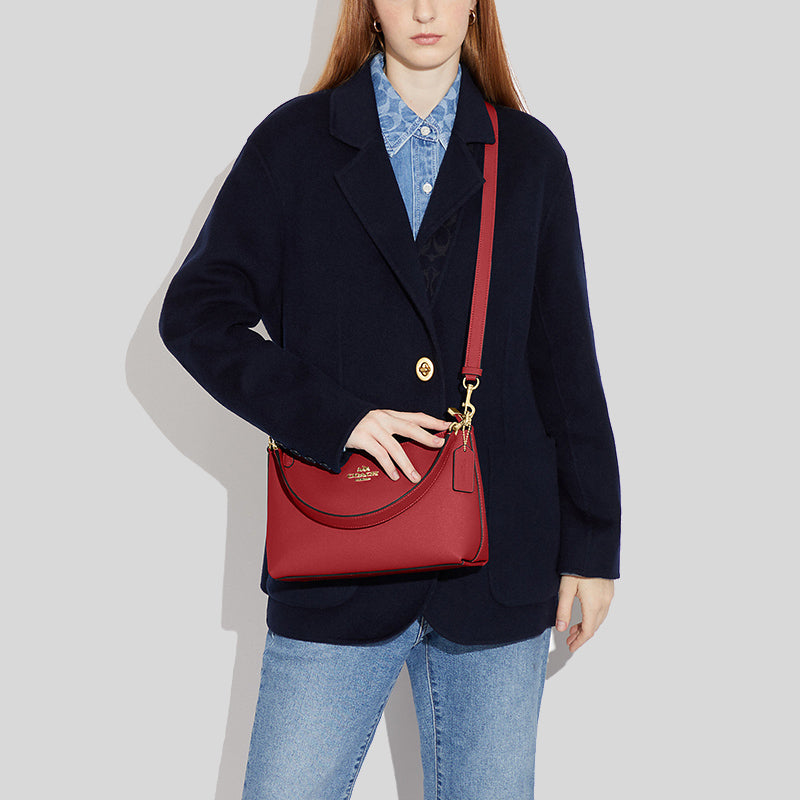 Coach bag with red discount handle