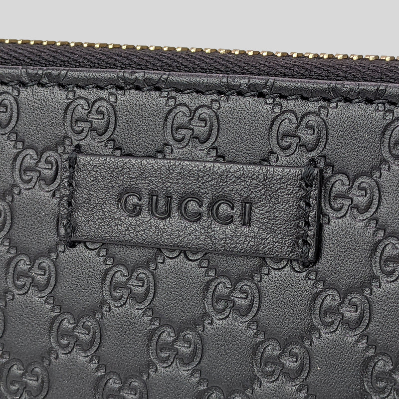 GUCCI Unisex Black Microguccissima GG Logo Leather Zip Around Wallet With Leather Logo Tab Black 449391